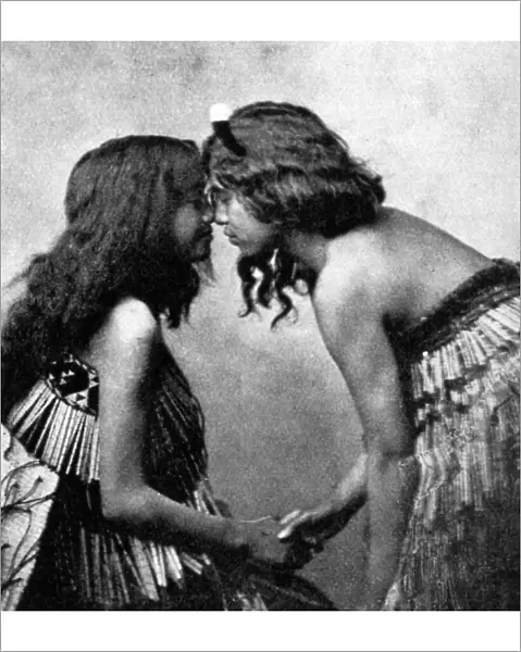Maori girls rubbing noses, c1920