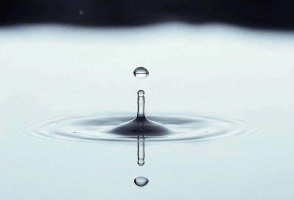 Water drop impact. High-speed photograph of secondary drop