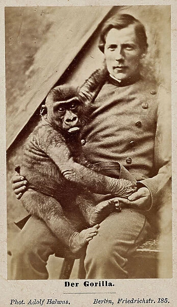 Portrait of a man with a small gorilla