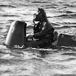 Hoisting a Chariot manned torpedo on board a ship available as Framed ...