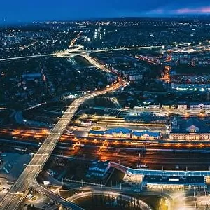 Brest, Belarus. Aerial Bird's-eye View Of Cityscape Skyline. Night Traffic In Residential District. Night Aerial View Of Railway Station. Panorama