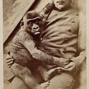 Portrait of a man with a small gorilla