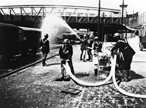 Drill Photographic Print Collection: GWR fire brigade at Paddington Station taking part in a drill, c. 1940
