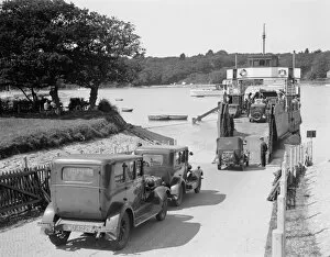 Railway Posters Fine Art Print Collection: Cars and motorcycles arriving on board the ferry at Fishbourne, 1932