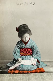 Related Images Fine Art Print Collection: Japanese girl practising calligraphy
