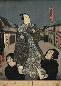 Robe Collection: Puppet in kimono being manipulated by two bunraku puppeteers