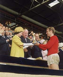 British Library Collection: Queen Elizabeth II presents Bobby Moore with World Cup