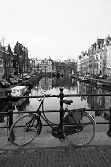 Netherlands Fine Art Print Collection: Black and white image of an old bicycle by the Singel canal, Amsterdam