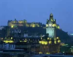 Lothian Collection: Edinburgh Castle and the Waverley Hotel clock tower illuminated at dusk