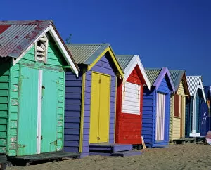 Beach Hut Collection: Exterior of a row of beach huts painted in bright primary colours, Brighton Beach