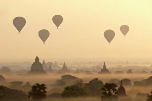 Myanmar Collection: Hot air ballons fly over ancient temples at dawn in Bagan (Pagan), Myanmar (Burma), Asia