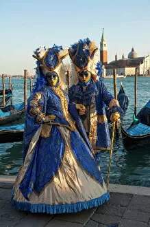 Identity Collection: Two ladies in blue and gold masks, Venice Carnival, Venice, UNESCO World Heritage Site