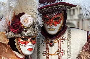 Identity Collection: Lady and gentleman in red and white masks, Venice Carnival, Venice, Veneto, Italy, Europe