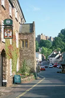 Sign Collection: Luttrell Arms Hotel and Dunster Castle beyond, Dunster, Somerset, England