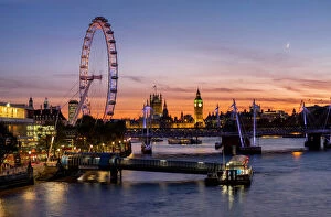 London Eye Collection: Millenium Wheel (London Eye) with Big Ben on the skyline beyond at sunset, London