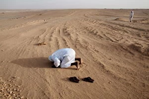 Sudan Collection: Muslims pray in the Nubian desert