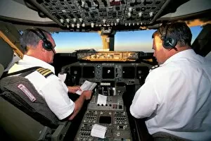 Head And Shoulder Collection: Pilots on flight deck of Jumbo Boeing 747 of Air New Zealand with sunrise ahead