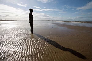 Sculptures Collection: Another Place sculpture by Antony Gormley on the beach at Crosby, Liverpool