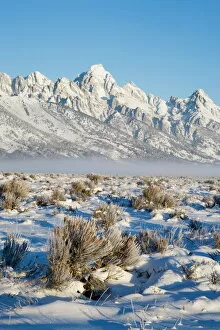Tetons Collection: Tetons with first light in the valley with snow