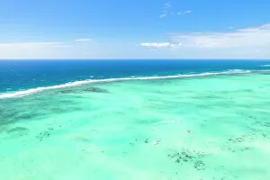 Indian Ocean Collection: Turquoise coral reef meeting the blue Indian Ocean, aerial view by drone, Ile Aux Cerfs