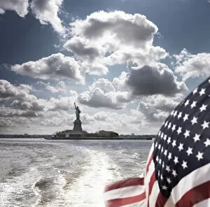 American Flag Collection: View of Statue of Liberty from rear of bot with Stars and Stripes flag