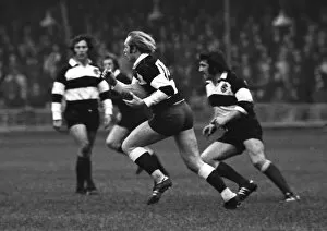 Rugby Collection: David Duckham runs with the ball for the Barbarians against the All Blacks in 1973