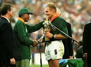 Related Images Collection: Francois Pienaar receives the Webb Ellis Cup from Nelson Mandela
