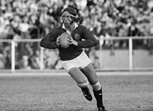 Rugby Canvas Print Collection: JPR Williams runs with the ball for the British Lions