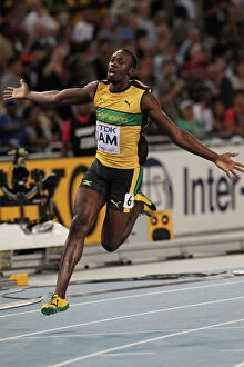 Related Images Photographic Print Collection: Usain Bolt anchors Jamaica to World Championship relay gold & a new WR
