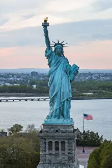 Statue Of Liberty Collection: Aerial of the Statue of Liberty at sunset, New York, USA