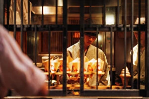 Seafood Collection: Chef preparing takoyaki famous street food in Osaka, Japan