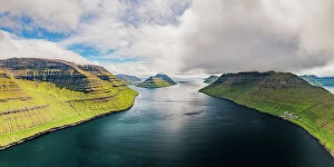Denmark Collection: Cloudy sky over the blue Atlantic Ocean and cliffs of Kunoy and Kalsoy islands, aerial view