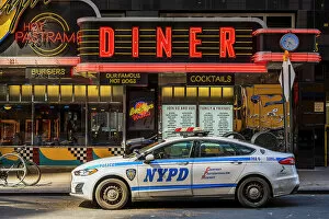 Diner Collection: Diner restaurant neon sign with NYPD police car parked, Manhattan, New York, USA