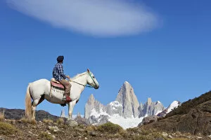 Landscape paintings Photo Mug Collection: A gaucho of the Estancia Bonanza looking at Mount Fitz Roy, El Chalten, Argentina. (MR)