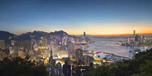 The City at Night Photographic Print Collection: Skyline of Hong Kong Island and Kowloon at sunset, Hong Kong
