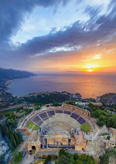 Italy Mouse Mat Collection: Taormina, Sicily. Aerial view of the Greek theater with the sun rising on the sea in the