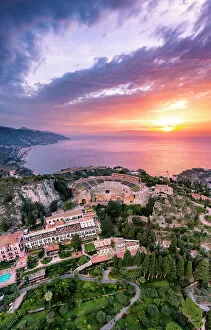 Italy Collection: Taormina, Sicily. Aerial view of the Greek theater with the sun rising on the sea in the