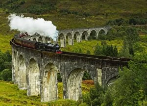 Landscape paintings Mouse Mat Collection: UK, Scotland, Highlands, Jacobite Steam Train crossing the Glenfinnan Viaduct