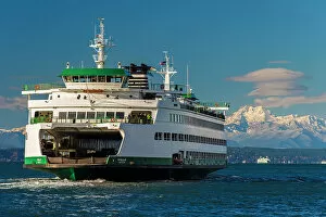 Seattle Collection: Washington State Ferry with snowy mountains of Olympic Peninsula in the background
