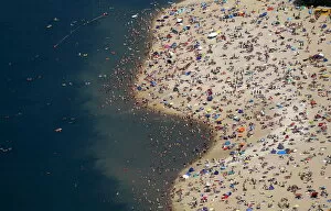 Germany Cushion Collection: An aerial view shows people at a beach on the shores of the Silbersee lake on a hot