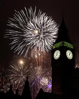 Britain Photographic Print Collection: Fireworks explode behind the Big Ben clock tower during New Year celebrations in London