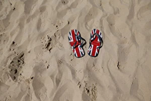 Weather Jigsaw Puzzle Collection: A pair of flip-flops printed with the Union flag sit on an urban beach during hot