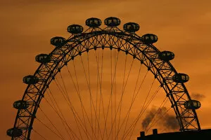 United Kingdom Collection: The sun sets behind the London Eye in central London