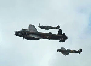 Lancaster Collection: Lancaster Bomber with 2 Spitfire Fighter planes, 2011 Goodwood revival