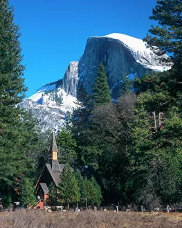 Sierra Collection: Californias Yosemite National Parks Half Dome rises above the multi denominational