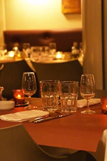 Viticulture Collection: Interior of The restaurant Brunel at night. Tables with glasses, knives, ofrks, glasses