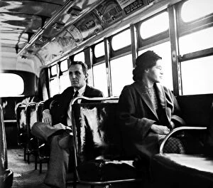 Related Images Cushion Collection: American civil rights advocate. Parks sits at the front of a public bus (formerly whites only)