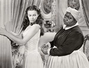 Film Collection: GONE WITH THE WIND, 1939. Hattie McDaniel assists Vivien Leigh while offering some unwelcomed advice