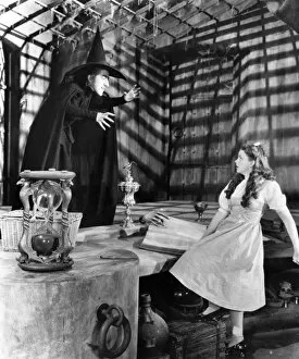 Hamilton Collection: WIZARD OF OZ, 1939. Margaret Hamilton as the Wicked Witch of the West and Judy Garland as Dorothy