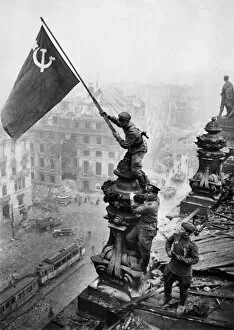 Related Images Cushion Collection: Red army soldiers raising the soviet flag over the reichstag in berlin, germany, april 30, 1945